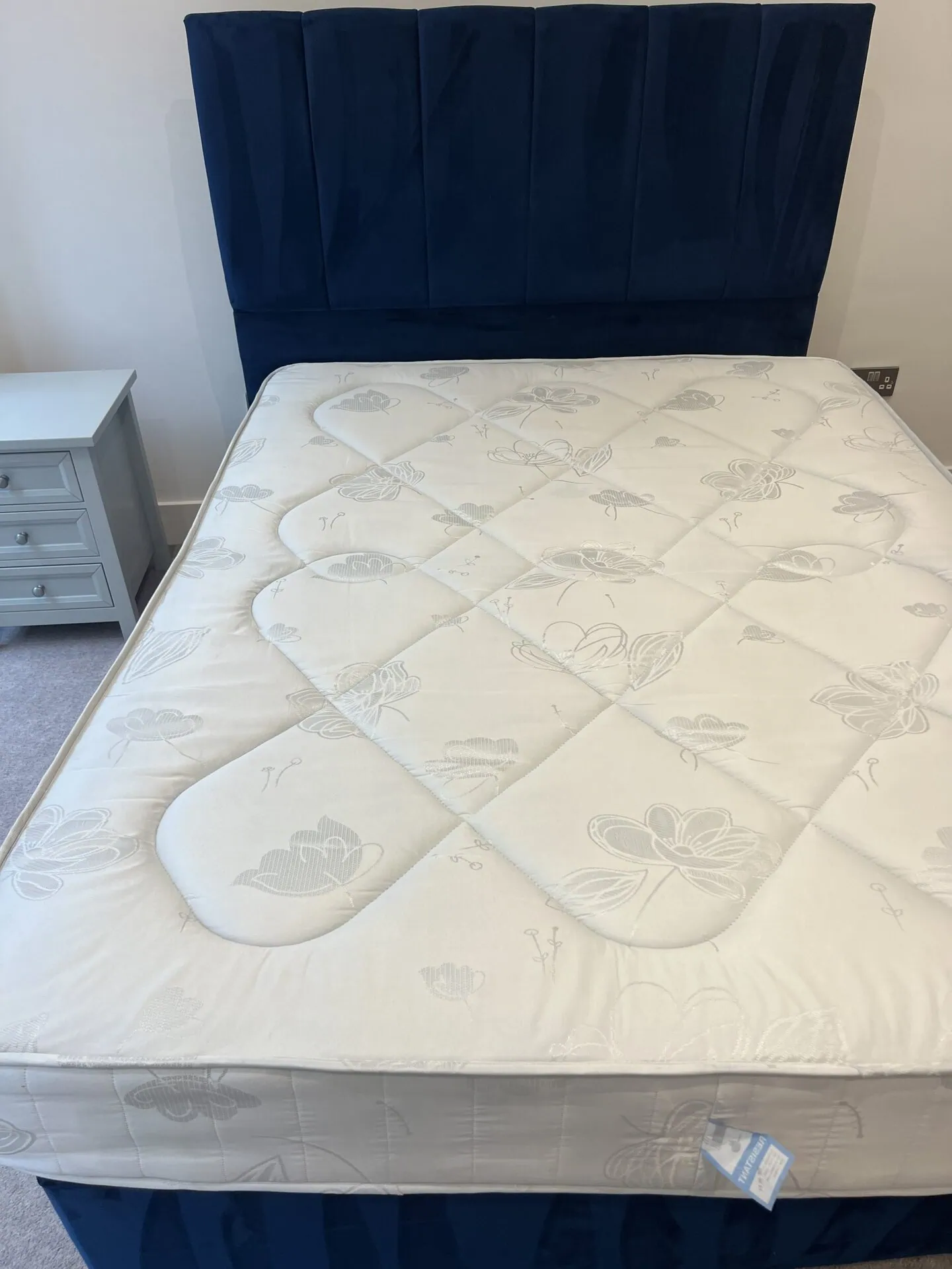 The same double mattress after professional stain removal and hot water extraction, stains lifted and fabric bright again