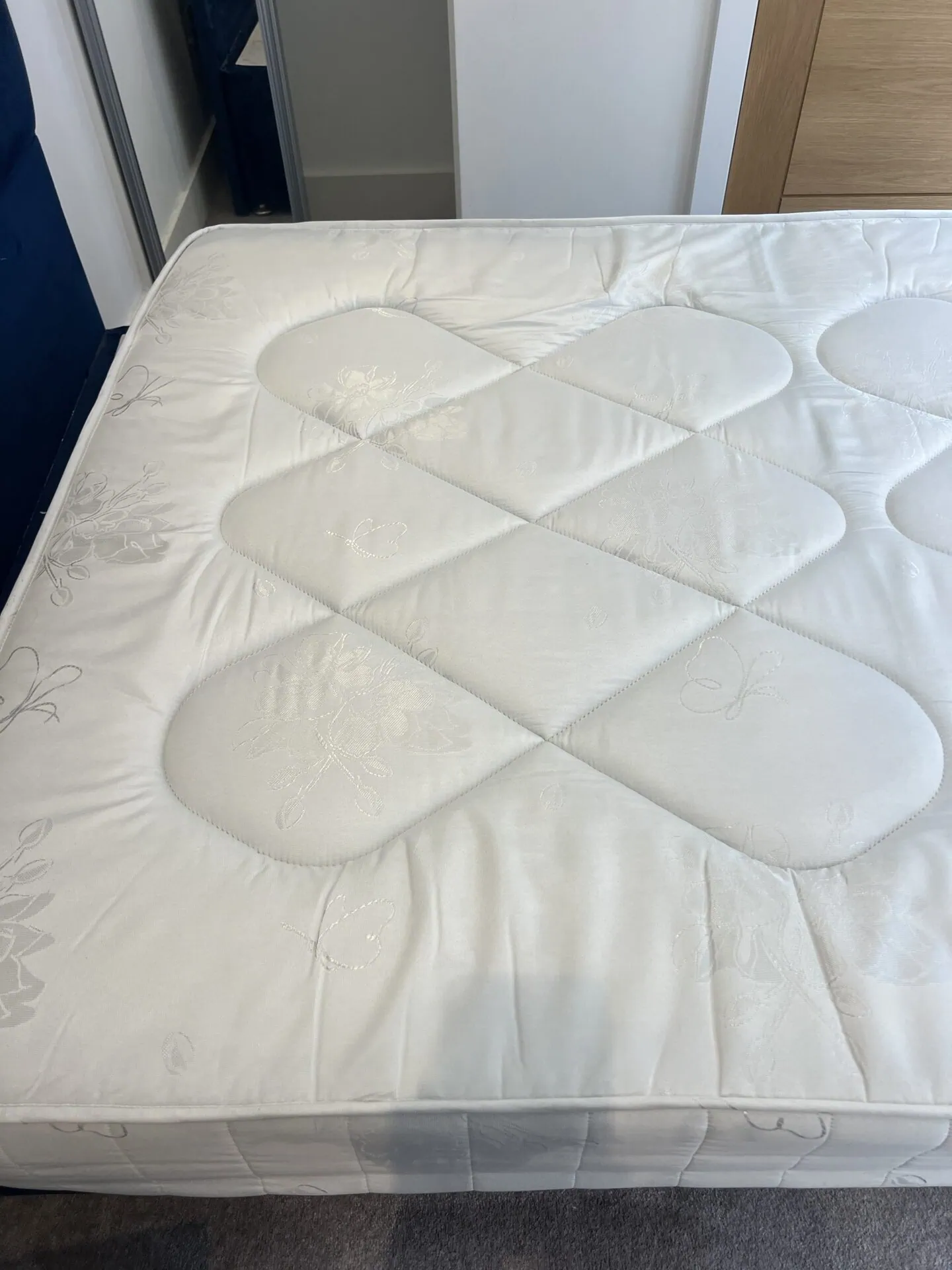 The same mattress after urine stain treatment and hot water extraction, stain removed